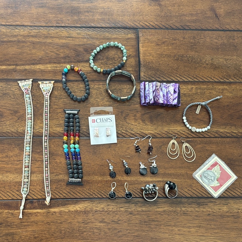 Apple Watch bands and assorted earrings, and bracelets